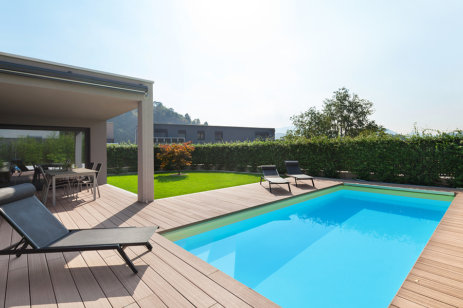 modern house with pool, loungers sun by the pool