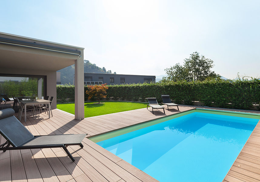 modern house with pool, loungers sun by the pool